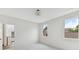 Bright bedroom with neutral walls, trim, carpet, and views of the surrounding neighborhood at 504 Barrington Drive, Roswell, GA 30075