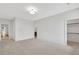 Spacious bedroom with neutral carpet and access to an ensuite bathroom and walk-in closet at 504 Barrington Drive, Roswell, GA 30075