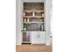 Contemporary butler's pantry with chic decor and a built-in wine fridge at 504 Barrington Drive, Roswell, GA 30075