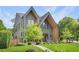 Charming two-story house with lush greenery, manicured lawn, and a welcoming walkway at 504 Barrington Drive, Roswell, GA 30075