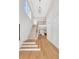 Bright foyer with high ceilings and open staircase leading to an upper level dining area at 504 Barrington Drive, Roswell, GA 30075