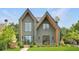 Stunning home showcasing modern design, a well-kept lawn, and meticulously landscaped grounds at 504 Barrington Drive, Roswell, GA 30075