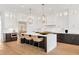 Spacious kitchen with a large island, pendant lighting, and stainless steel appliances at 504 Barrington Drive, Roswell, GA 30075