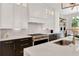 This kitchen features stainless steel appliances, a gas range, and modern cabinetry at 504 Barrington Drive, Roswell, GA 30075