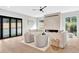 Inviting living room with a modern fireplace, plush seating, and large windows overlooking the backyard at 504 Barrington Drive, Roswell, GA 30075