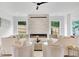 Bright living room featuring an electric fireplace and neutral furniture at 504 Barrington Drive, Roswell, GA 30075