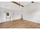 Bright main bedroom featuring high ceilings, exposed beams, hardwood floors and an ensuite bathroom at 504 Barrington Drive, Roswell, GA 30075