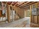 Unfinished basement featuring open layout, stairs, and concrete flooring, ready for personalized finishing touches at 6132 Hutchins Dr, Buford, GA 30518
