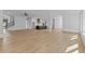 Open floor plan featuring hardwood floors connecting the living area to the kitchen at 6132 Hutchins Dr, Buford, GA 30518