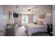 Cozy bedroom featuring a queen-sized bed, dresser, soft lighting, and a picturesque window view at 10 Stagg Trce, Social Circle, GA 30025
