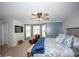 Spacious main bedroom boasts a cozy seating area, ceiling fan and great natural light at 10 Stagg Trce, Social Circle, GA 30025