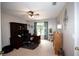 Bright office with a ceiling fan, dark wood furnishings, and natural light from a window with patterned curtains at 10 Stagg Trce, Social Circle, GA 30025