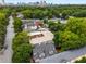 A partial aerial view showcases the building's roof, tree-lined neighborhood and a city skyline at 1038 Saint Charles Ave, Atlanta, GA 30306