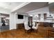 Finished basement with dining area, kitchenette, tv and adjacent gym with workout equipment at 1038 Saint Charles Ave, Atlanta, GA 30306