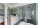 Elegant bathroom equipped with a double vanity, frameless shower, and luxurious soaking tub, designed for relaxation at 1038 Saint Charles Ave, Atlanta, GA 30306