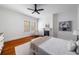 Bright bedroom featuring hardwood floors, fireplace, and white walls that create a serene and inviting atmosphere at 1038 Saint Charles Ave, Atlanta, GA 30306
