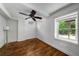 Bright bedroom with hardwood floors, ceiling fan and beam ceiling at 1038 Saint Charles Ave, Atlanta, GA 30306