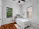 Well-lit bedroom with gleaming hardwood floors and a view of the lush outdoors, providing a refreshing living space at 1038 Saint Charles Ave, Atlanta, GA 30306