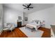 Charming bedroom featuring hardwood floors, an ornate fireplace, and a comfortable seating area, offering a relaxing retreat at 1038 Saint Charles Ave, Atlanta, GA 30306