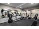 Home gym featuring free weights, elliptical, and punching bag at 1038 Saint Charles Ave, Atlanta, GA 30306
