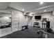 Well-equipped home gym with various machines, free weights, and mirrored wall at 1038 Saint Charles Ave, Atlanta, GA 30306