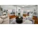 Open-concept living room with hardwood floors and views of the dining area at 1038 Saint Charles Ave, Atlanta, GA 30306