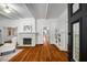 Bright living room with hardwood floors, a marble fireplace, and elegant white trim at 1038 Saint Charles Ave, Atlanta, GA 30306