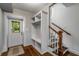 Well-organized mudroom with custom storage solutions and staircase at 1038 Saint Charles Ave, Atlanta, GA 30306