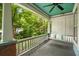 Relaxing front porch featuring a swing and views of the beautifully landscaped front yard at 1038 Saint Charles Ave, Atlanta, GA 30306