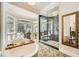 Well-lit bathroom with soaking tub, spacious glass shower, and stylish vanities at 111 Cherry Hill Dr, Marietta, GA 30067