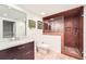 The bathroom features a stylish vanity and glass-enclosed tiled shower with updated fixtures at 111 Cherry Hill Dr, Marietta, GA 30067