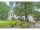 Traditional two-story home featuring a well-manicured front yard with mature trees at 111 Cherry Hill Dr, Marietta, GA 30067