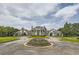 Stately home with circular driveway, manicured landscaping, and elegant exterior details at 111 Cherry Hill Dr, Marietta, GA 30067
