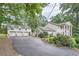 Traditional home with a multi-car garage, well-manicured lawn, and a basketball hoop at 111 Cherry Hill Dr, Marietta, GA 30067