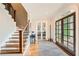 Inviting foyer featuring hardwood floors, staircase, and a view through glass doors at 111 Cherry Hill Dr, Marietta, GA 30067