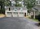 Exterior of a large multi-car garage with dormer windows at 111 Cherry Hill Dr, Marietta, GA 30067