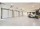 Spacious 3-car garage with ample storage and a golf cart at 111 Cherry Hill Dr, Marietta, GA 30067