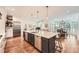 Bright open kitchen with an island, stainless steel appliances, and hardwood floors at 111 Cherry Hill Dr, Marietta, GA 30067