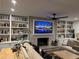 A cozy living room with a decorative fireplace and built-in shelving. Sofas and a ceiling fan add comfort at 111 Cherry Hill Dr, Marietta, GA 30067