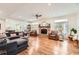 Open-concept living room with hardwood floors, fireplace, and neutral decor at 111 Cherry Hill Dr, Marietta, GA 30067