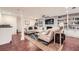 Relaxing living area featuring built-in shelving, stylish decor, hardwood floors and comfortable seating at 111 Cherry Hill Dr, Marietta, GA 30067