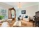 Cozy living room featuring hardwood floors, stylish furnishings, and ample natural light at 111 Cherry Hill Dr, Marietta, GA 30067