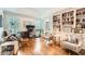 Bright home office with custom built-in bookshelves and comfortable seating area at 111 Cherry Hill Dr, Marietta, GA 30067