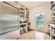 Walk-in pantry offers ample storage, natural light, and hardwood floors at 111 Cherry Hill Dr, Marietta, GA 30067