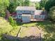 Picture of the back of the house, a back deck, and a fenced in area for gardening at 1647 Grandeus Sw Ln, Stone Mountain, GA 30087