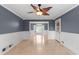Dining area with tile floors and contemporary chandelier in a newly renovated home at 1647 Grandeus Sw Ln, Stone Mountain, GA 30087