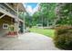 Beautiful backyard with a patio, swing, hot tub, lush lawn, and an outdoor pergola with seating at 2001 Mclain Nw Rd, Acworth, GA 30101