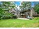 Expansive backyard with two-story deck, a patio, hot tub and lush lawn; perfect for outdoor living at 2001 Mclain Nw Rd, Acworth, GA 30101