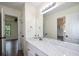 Clean bathroom featuring a marble vanity and large mirror to prepare for the day at 2001 Mclain Nw Rd, Acworth, GA 30101