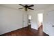 Bedroom with hardwood floors, ceiling fan, and easy access to the bathroom at 2001 Mclain Nw Rd, Acworth, GA 30101